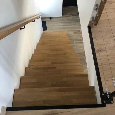 Steel central stringer staircase with custom oak steps