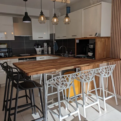 Open kitchen with custom acacia worktop