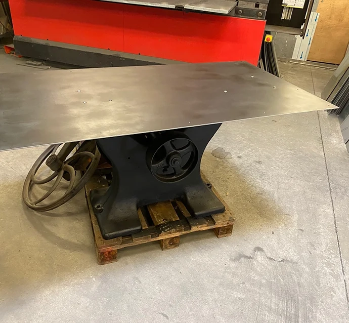 Custom table with foot of an old band saw