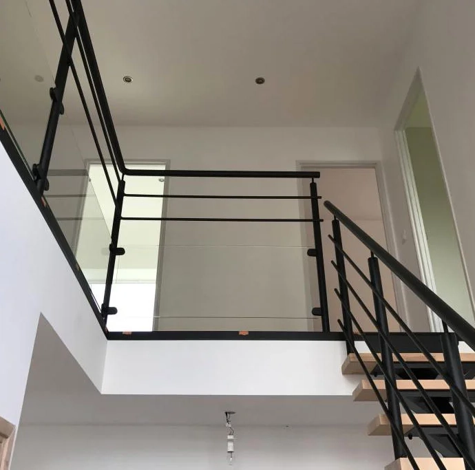 Installation of steel staircase with solid wood steps