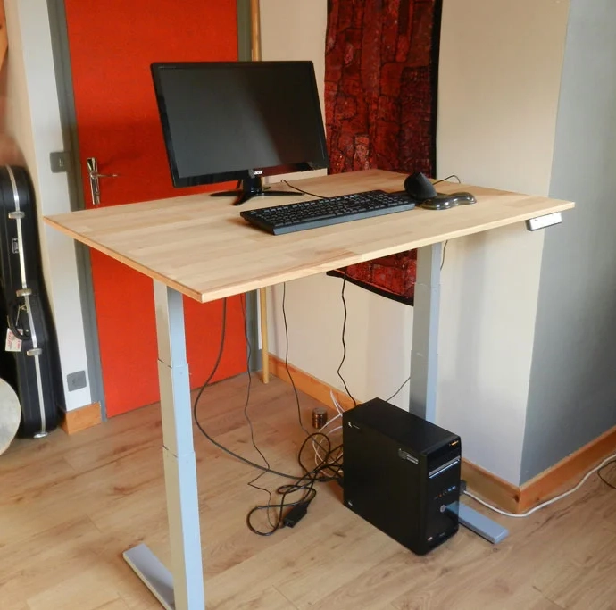 Manufacture of adjustable height desk with custom-cut wooden top