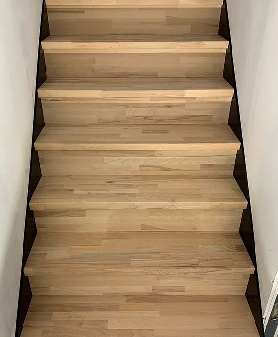 Custom-made staircase with steps and risers in solid beech