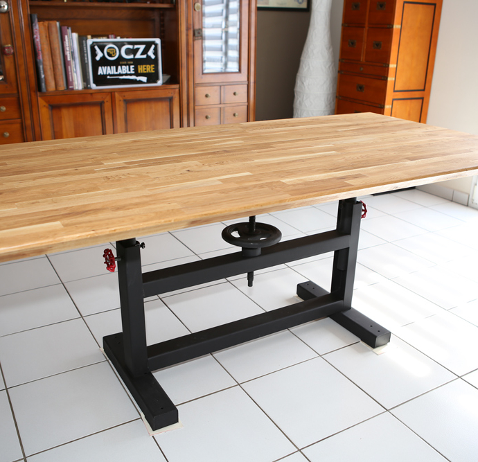 Industrial table with wooden top and workbench foot