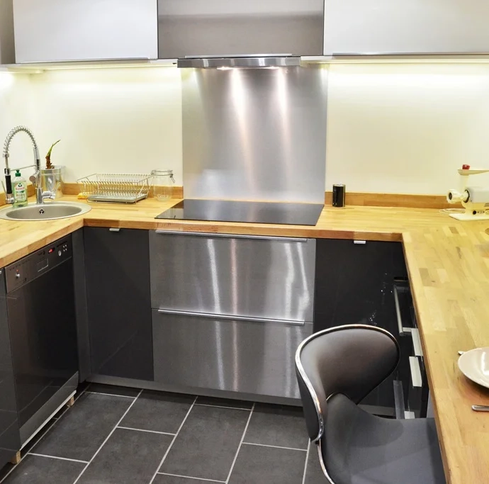 U-shaped kitchen renovation with solid wood worktops