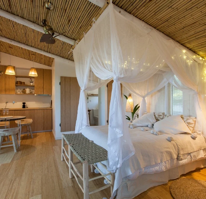 Custom wood furnishings in a hotel room hut