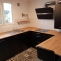 Kitchen layout with an assembly of custom beech worktops