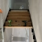Fixation de marche d'escalier en bois sur structure en métal