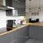 Modern IKEA kitchen with solid wood worktop and bar