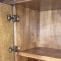 Wooden cupboard door assembly on bookcase