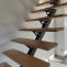 Straight metal wood staircase with custom oak steps