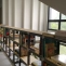 Custom wood and metal bookcase / railing for mezzanine