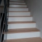 Solid beech steps on concrete staircase