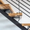 Staircase with metal structure and solid wood step