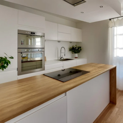 Kitchen layout with custom island in solid oak