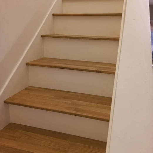 Dressed concrete staircase with custom oak steps